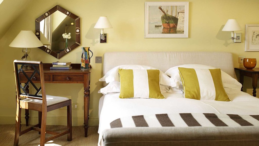 Maximizing Small Spaces - Natural light and lighting including wall lamps helps make a space look bigger